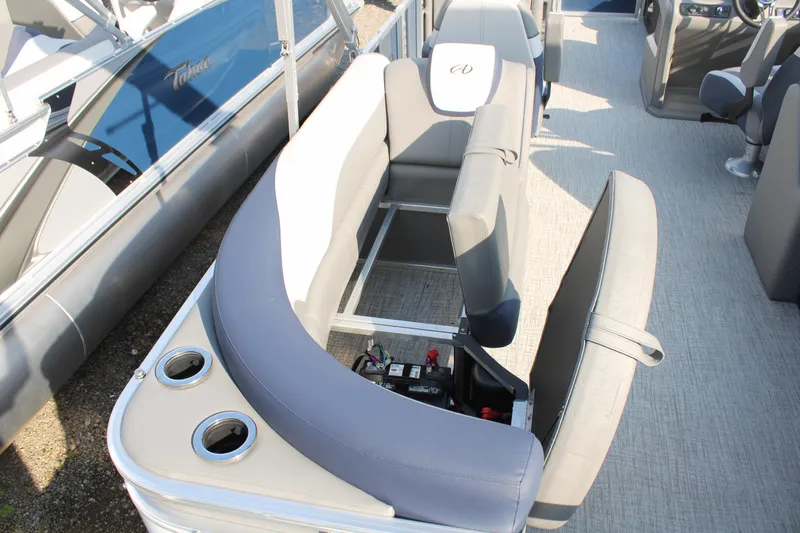 Slide: The Image of 2024 Avalon LSZ Quad Lounger interior with gray seating and cup holders. - 21