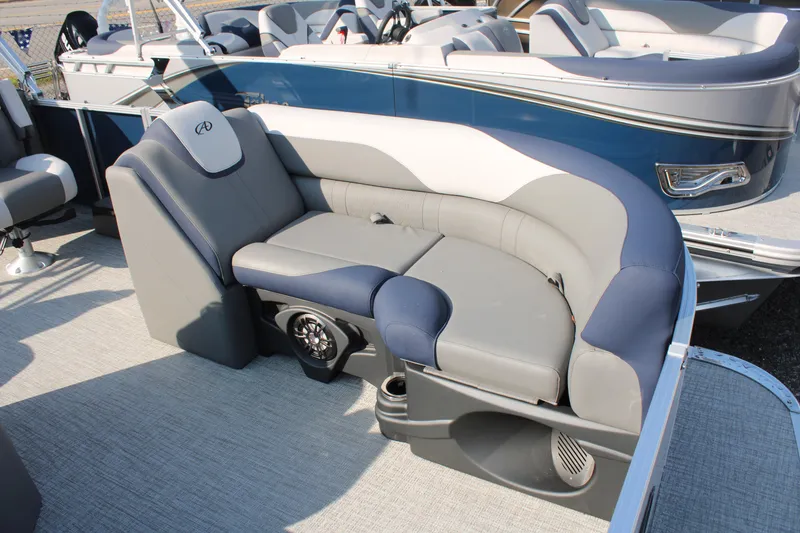 Slide: The Image of 2024 Avalon LSZ Quad Lounger boat interior with plush seating and modern design. - 5