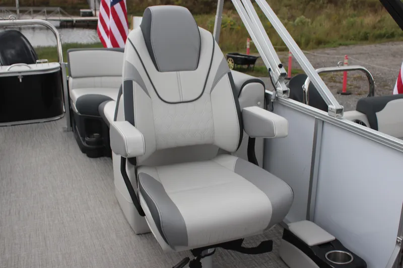 Slide: The Image of 2025 Avalon LSZ Quad Lounger boat seat with armrests, featuring modern design and comfort. - 22
