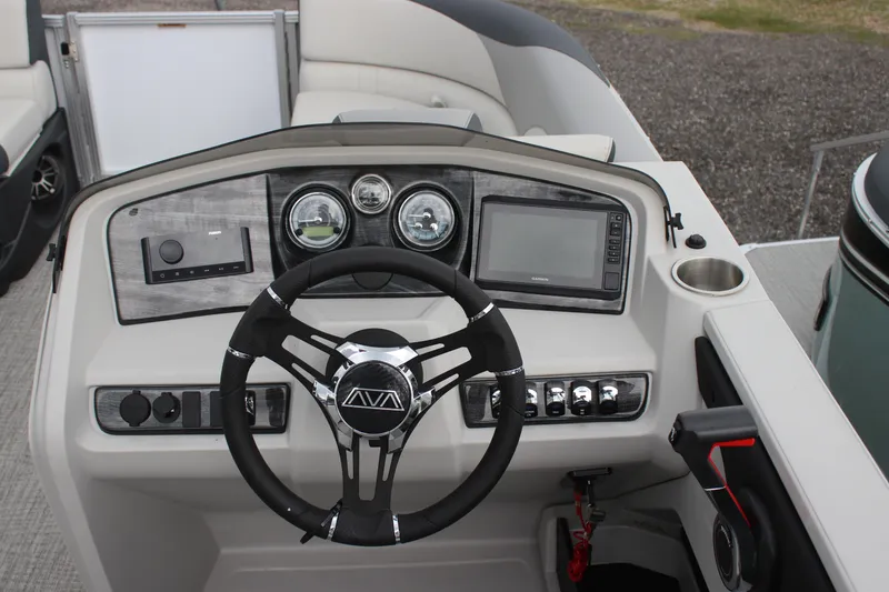 Slide: The Image of 2025 Avalon LSZ Quad Lounger dashboard with steering wheel, gauges, and control panel. - 24