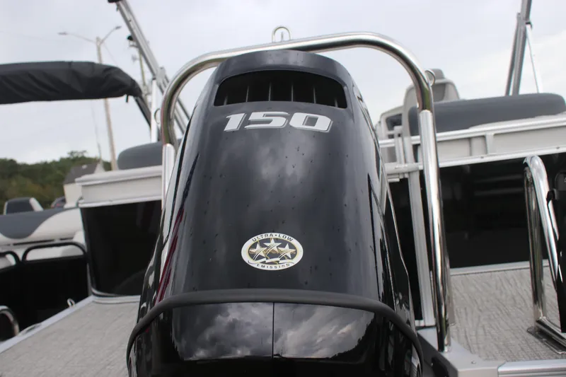 Slide: The Image of Avalon LSZ Quad Lounger 2025 with 150 horsepower engine, sleek black design. - 28