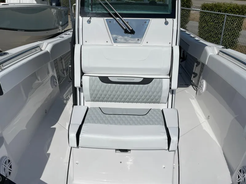 Slide: The Image of 2025 Blackfin 272CC boat interior with white seating and modern design. - 20