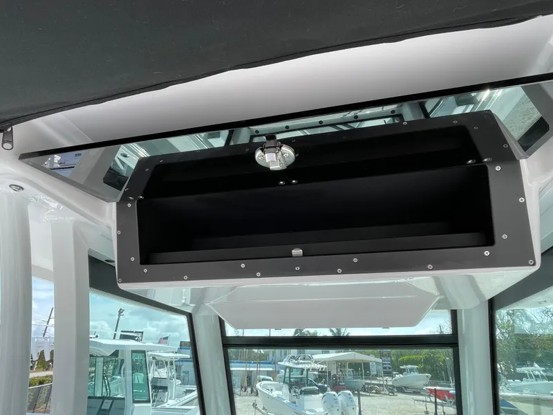 Slide: The Image of 2025 Blackfin 272CC boat interior with overhead storage compartment. - 26