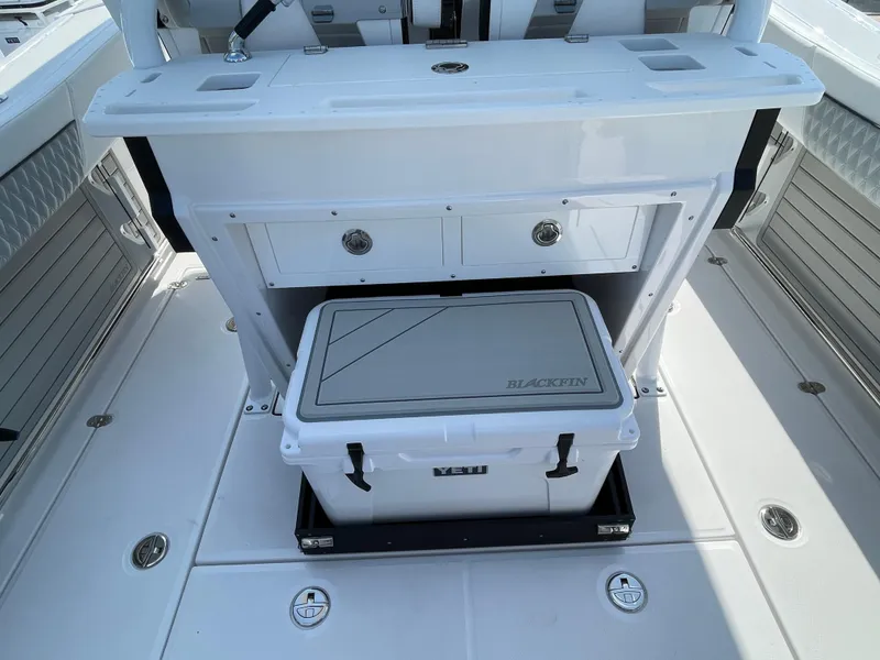Slide: The Image of 2025 Blackfin 272CC boat interior with storage drawers and cooler. - 31