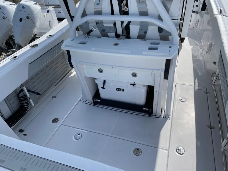 Slide: The Image of 2025 Blackfin 272CC boat deck with seating and storage compartments. - 34