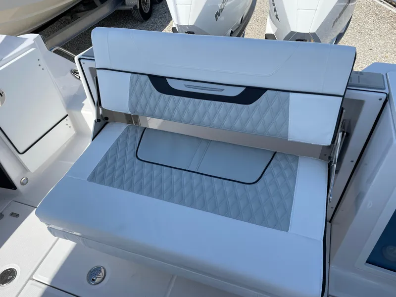 Slide: The Image of 2025 Blackfin 272CC boat with white cushioned seating and modern design. - 38