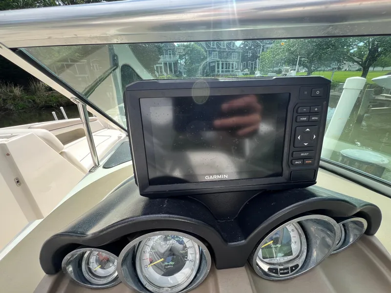 Slide: The Image of Dashboard of a 2010 Sea Ray 280 Sundeck with Garmin navigation system. - 11