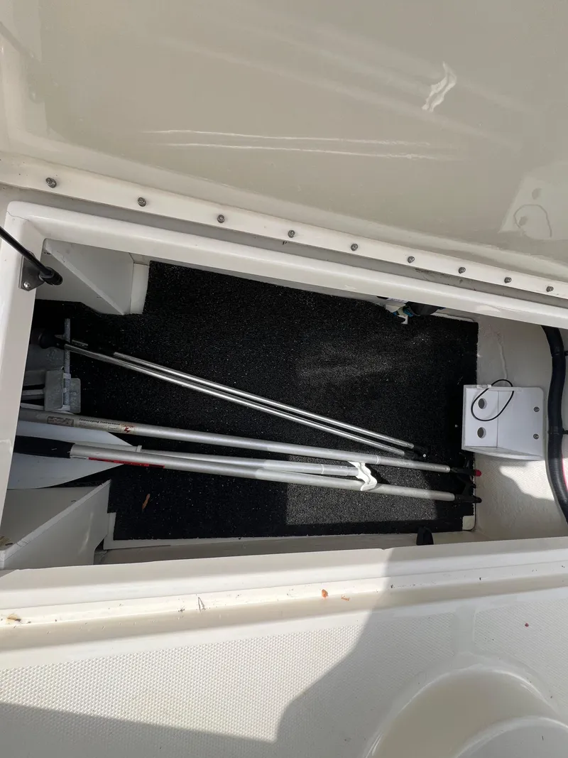 Slide: The Image of Storage compartment of a 2010 Sea Ray 280 Sundeck boat, showing interior details. - 18