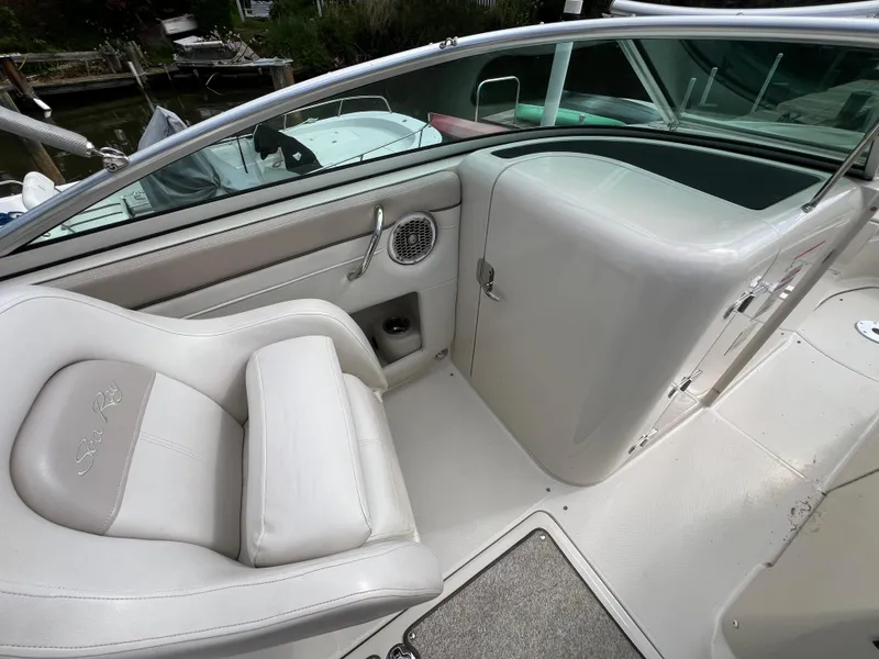 Slide: The Image of 2010 Sea Ray 280 Sundeck interior with white seating and sleek design. - 19