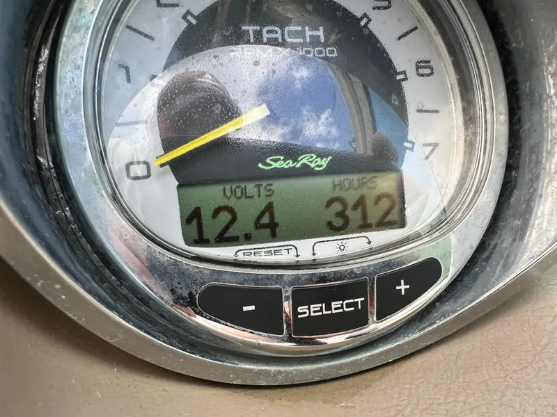 Slide: The Image of Close-up of 2010 Sea Ray 280 Sundeck tachometer showing 12.4 volts and 312 hours. - 23