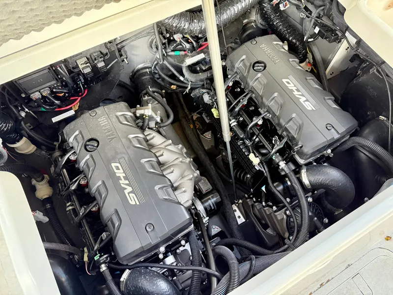 Slide: The Image of 2024 Yamaha Boats 255 FSH Sport H engine compartment with dual powerful motors. - 10