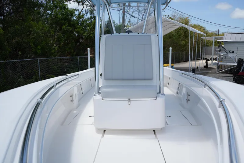 Slide: The Image of 2025 Contender 25T boat with sleek white deck and center console seating. - 16