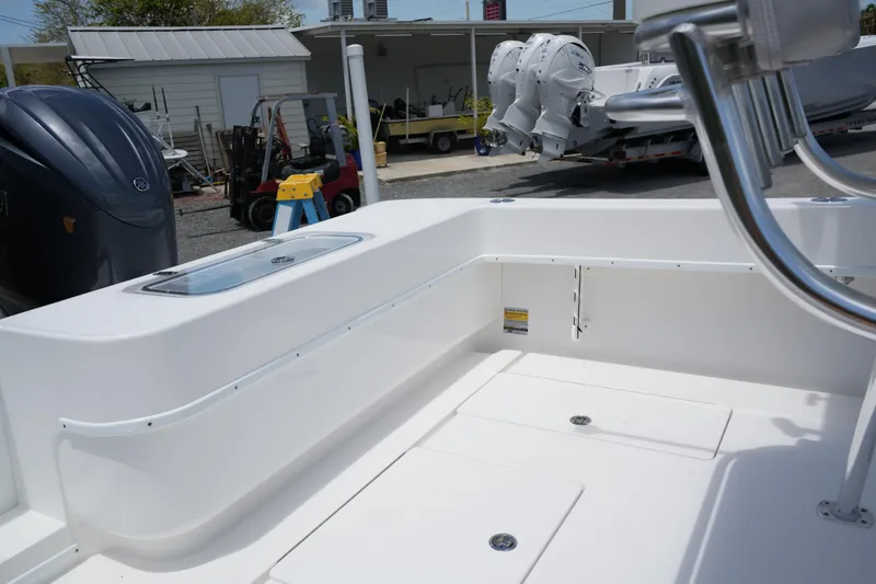 Slide: The Image of 2025 Contender 25T boat interior with sleek white design and modern features. - 5