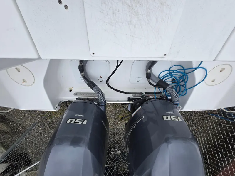 Slide: The Image of Twin 150 horsepower engines on a 2020 Sea Hunt Gamefish 25 boat. - 13