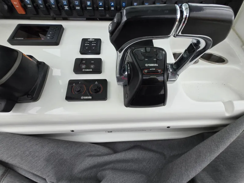 Slide: The Image of 2020 Sea Hunt Gamefish 25 boat controls with Yamaha throttle and dashboard instruments. - 16