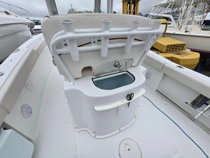 Slide: The Image of 2020 Sea Hunt Gamefish 25 boat with open livewell and rod holders. - 19