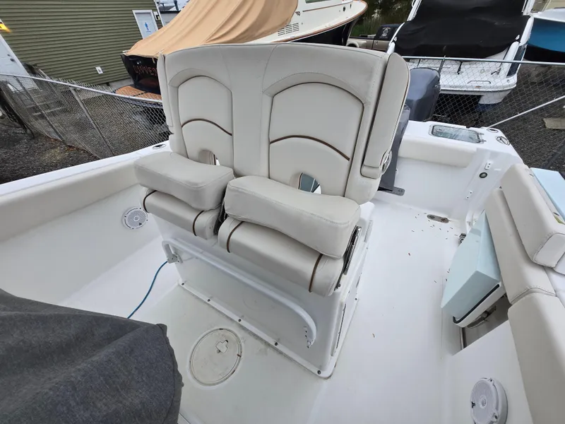 Slide: The Image of 2020 Sea Hunt Gamefish 25 boat with dual cushioned seats in white interior. - 20