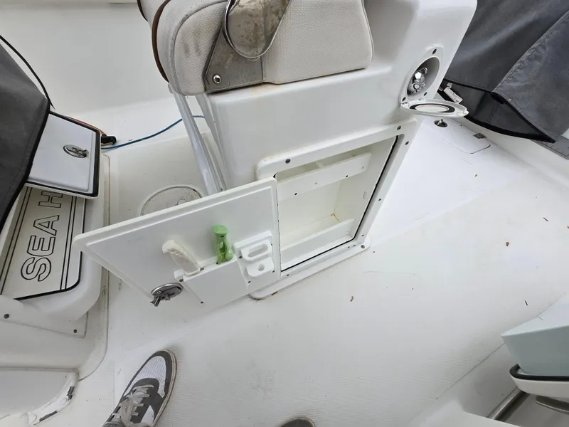 Slide: The Image of 2020 Sea Hunt Gamefish 25 boat interior with open storage compartment and seating. - 21