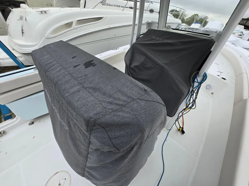 Slide: The Image of 2020 Sea Hunt Gamefish 25 boat interior with covered seats and console. - 24