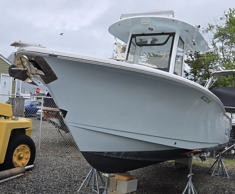 Slide: The Image of 2020 Sea Hunt Gamefish 25 boat on stands, outdoor display. - 4