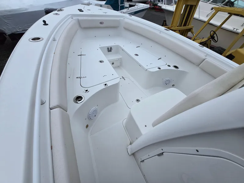 Slide: The Image of 2020 Sea Hunt Gamefish 25 boat interior, featuring spacious seating and storage compartments. - 6