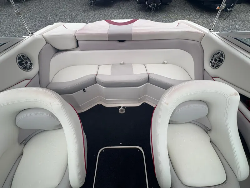 Slide: The Image of Interior of a 2012 Bryant 220 boat with white and gray seating. - 10