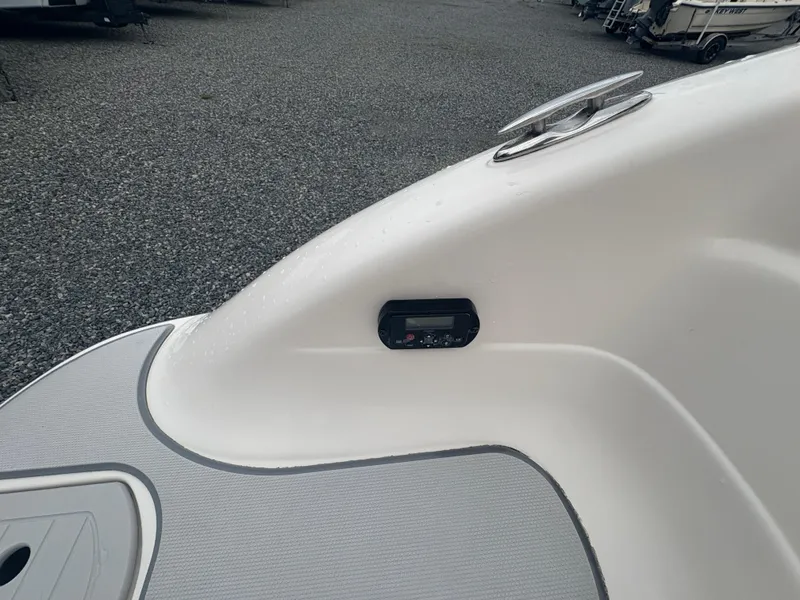 Slide: The Image of Bow area of a 2012 Bryant 220 boat with a control panel. - 20