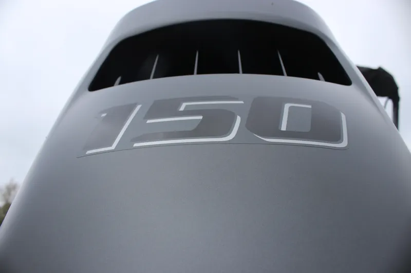 Slide: The Image of Close-up of Avalon VENTURE QUAD LOUNGER 2025 engine cover with "150" marking. - 13