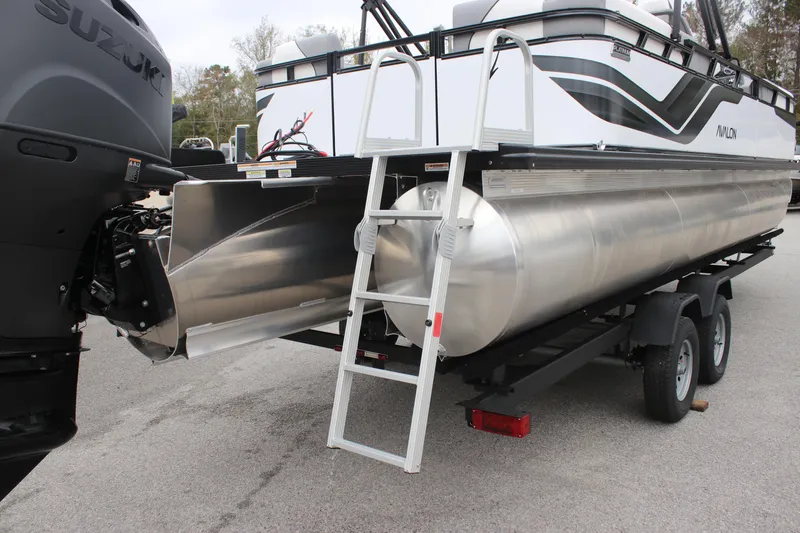 Slide: The Image of 2025 Avalon VENTURE QUAD LOUNGER pontoon boat on trailer with ladder and Suzuki engine. - 4