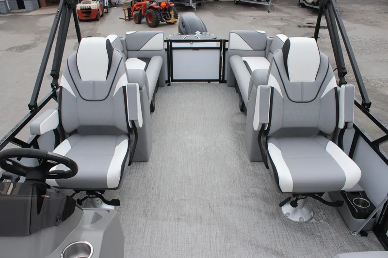 Slide: The Image of 2025 Avalon VENTURE QUAD LOUNGER interior with gray and white seating arrangement. - 8