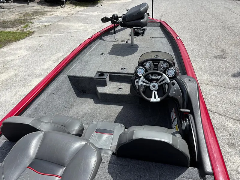 Slide: The Image of 2024 Tracker Pro Team 190 TX boat interior with steering wheel and seating. - 10