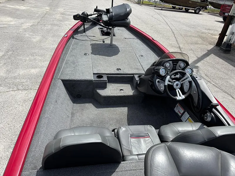 Slide: The Image of 2024 Tracker Pro Team 190 TX boat interior with steering console and seating. - 11