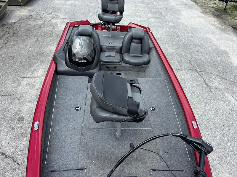 Slide: The Image of 2024 Tracker Pro Team 190 TX fishing boat with red exterior and seating arrangement. - 12
