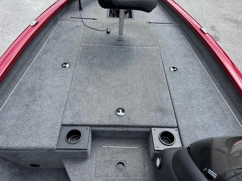 Slide: The Image of 2024 Tracker Pro Team 190 TX boat deck with gray carpeting and seating. - 14