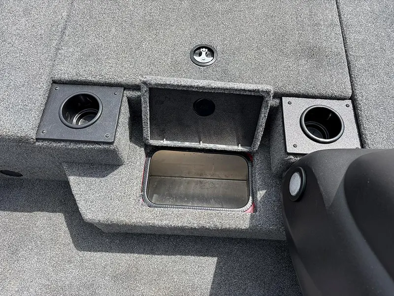 Slide: The Image of 2024 Tracker Pro Team 190 TX boat interior with storage compartments and cup holders. - 16