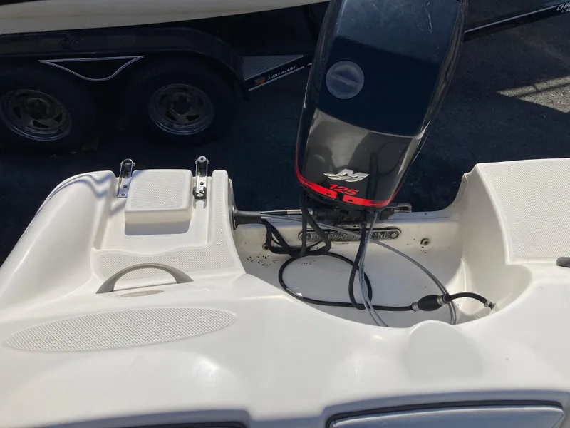 Slide: The Image of 2003 Bayliner 180 Bowrider boat engine and deck view. - 10