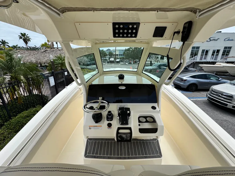Slide: The Image of 2025 Scout 305 LXF boat cockpit with modern controls and steering wheel. - 10