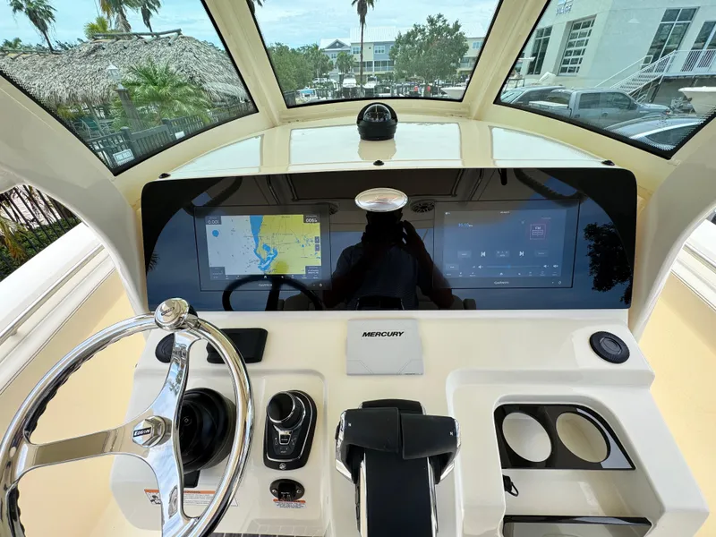 Slide: The Image of Helm of 2025 Scout 305 LXF boat with modern navigation and control systems. - 22