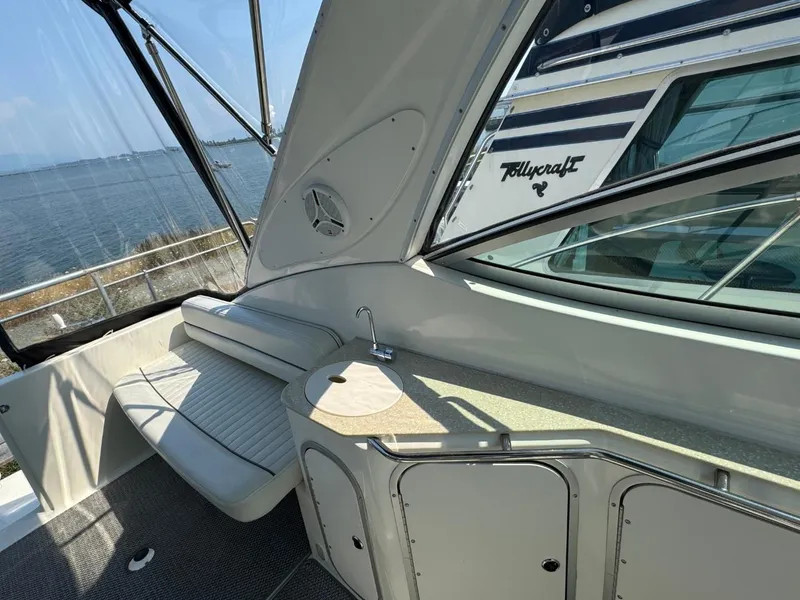 Slide: The Image of 2006 Maxum 3300 SE boat interior with seating and counter, overlooking water. - 22