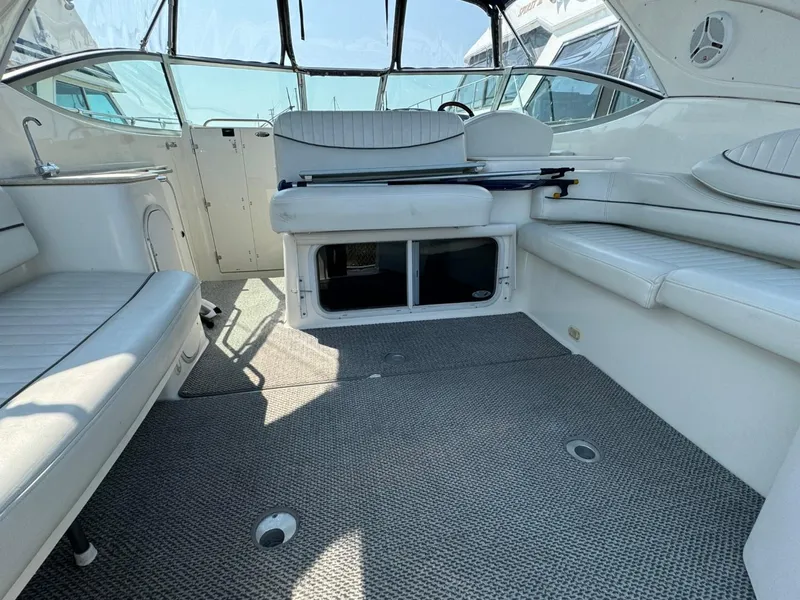 Slide: The Image of 2006 Maxum 3300 SE boat interior with white seating and carpeted floor. - 26