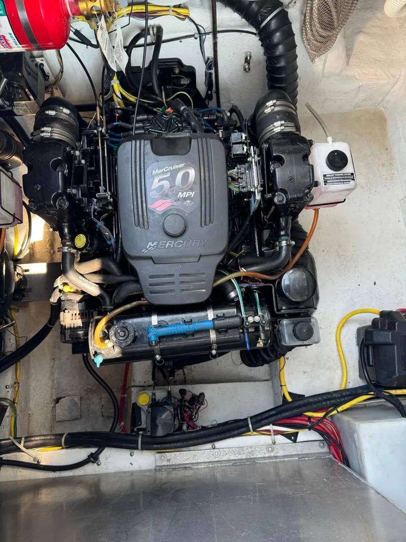 Slide: The Image of 2006 Maxum 3300 SE engine compartment with MerCruiser 5.0 MPI engine, detailed wiring visible. - 27