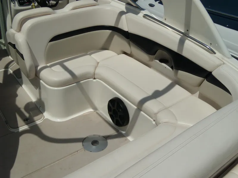 Slide: The Image of 2008 Chaparral SSX 276 boat interior with beige seating and black accents. - 10