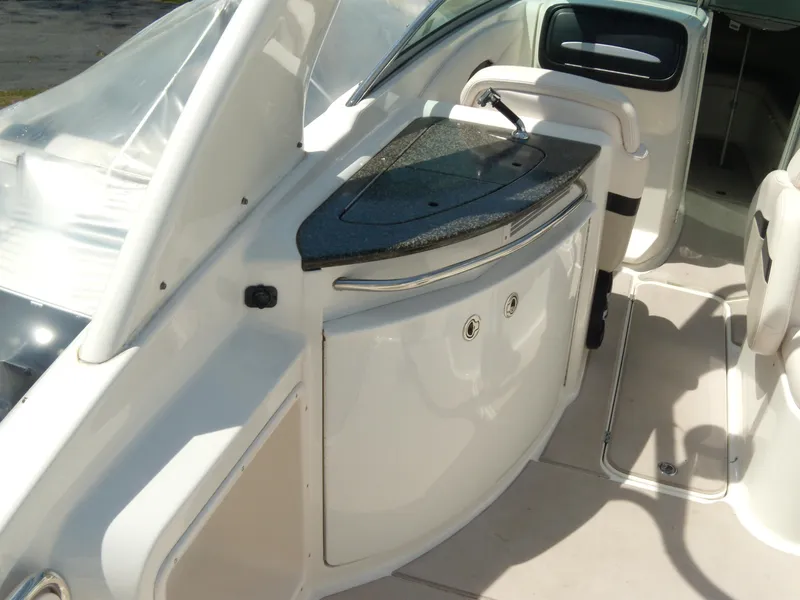 Slide: The Image of 2008 Chaparral SSX 276 boat interior with sleek countertop and seating area. - 11