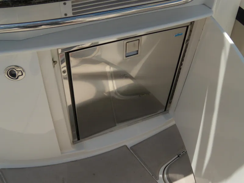 Slide: The Image of 2008 Chaparral SSX 276 boat interior with stainless steel refrigerator. - 12