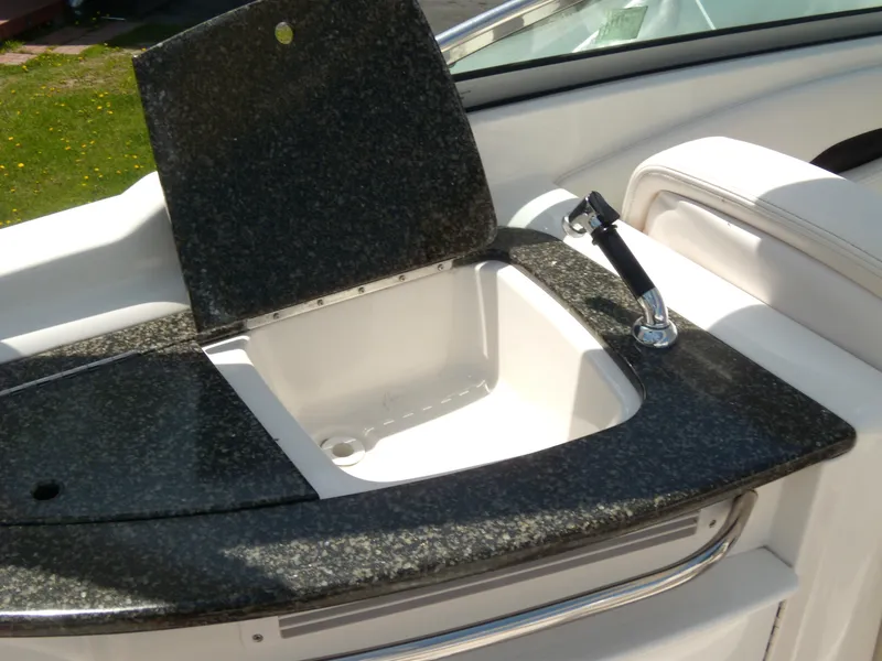 Slide: The Image of 2008 Chaparral SSX 276 boat sink with granite countertop and faucet. - 13