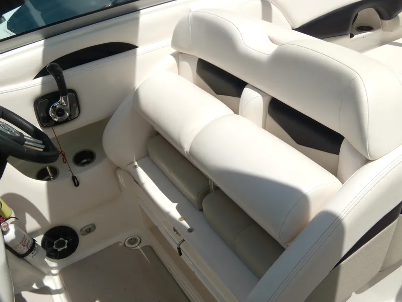 Slide: The Image of 2008 Chaparral SSX 276 boat interior with white seating and control panel. - 15