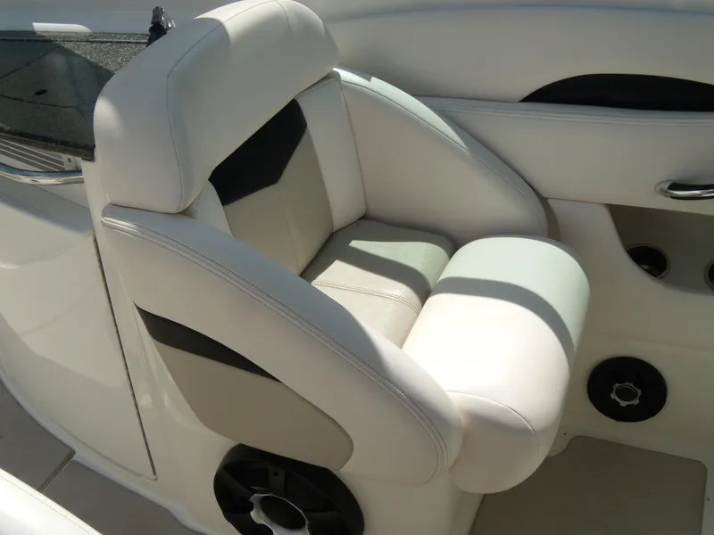 Slide: The Image of 2008 Chaparral SSX 276 boat interior with white leather seating and speaker. - 16