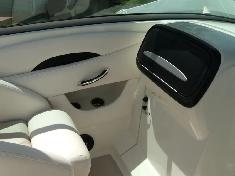 Slide: The Image of Interior of 2008 Chaparral SSX 276 boat, featuring sleek white seating and modern design. - 17