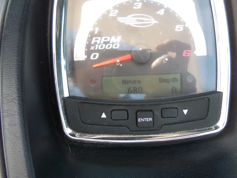 Slide: The Image of Close-up of 2008 Chaparral SSX 276 tachometer showing 680 hours. - 19