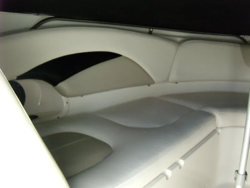 Slide: The Image of Interior cabin of 2008 Chaparral SSX 276 boat, featuring cushioned seating. - 23